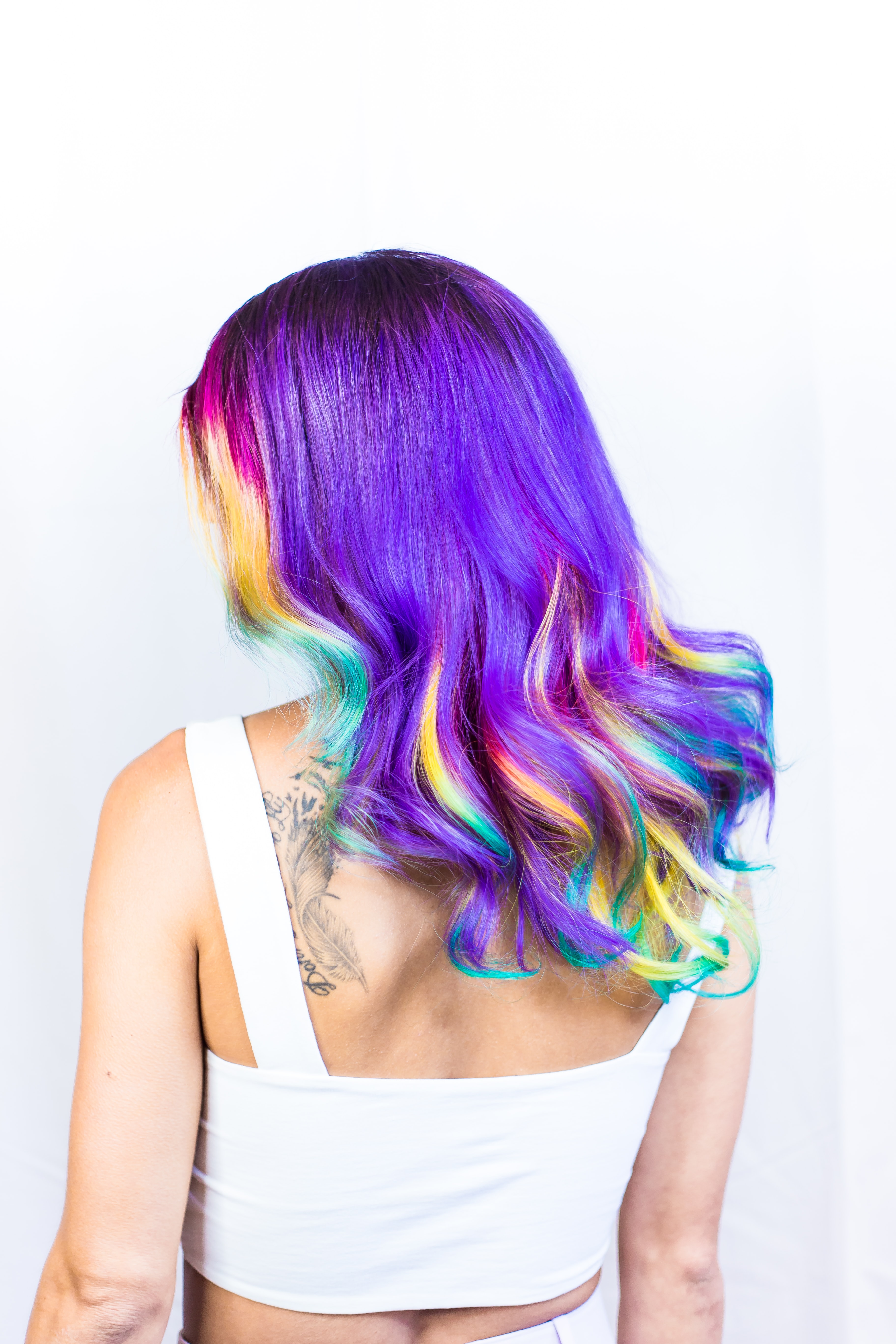 shoulder length rainbow colored hair